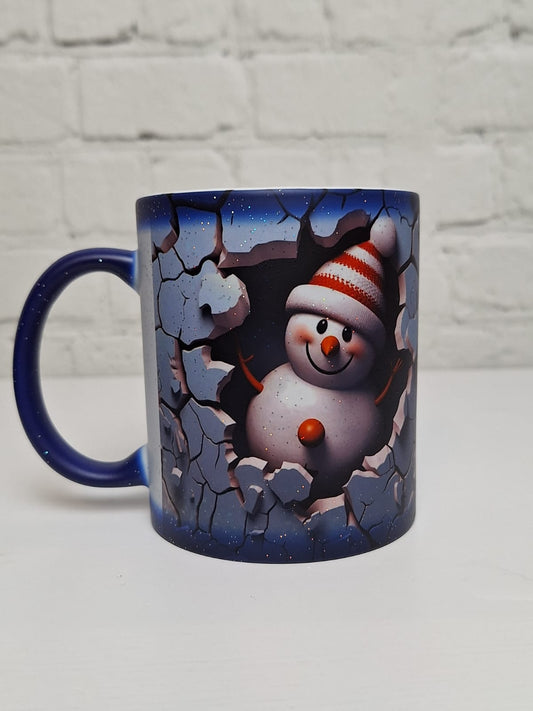 Glitzer-Zaubertasse „Guckguck Schneemann“ – Blau