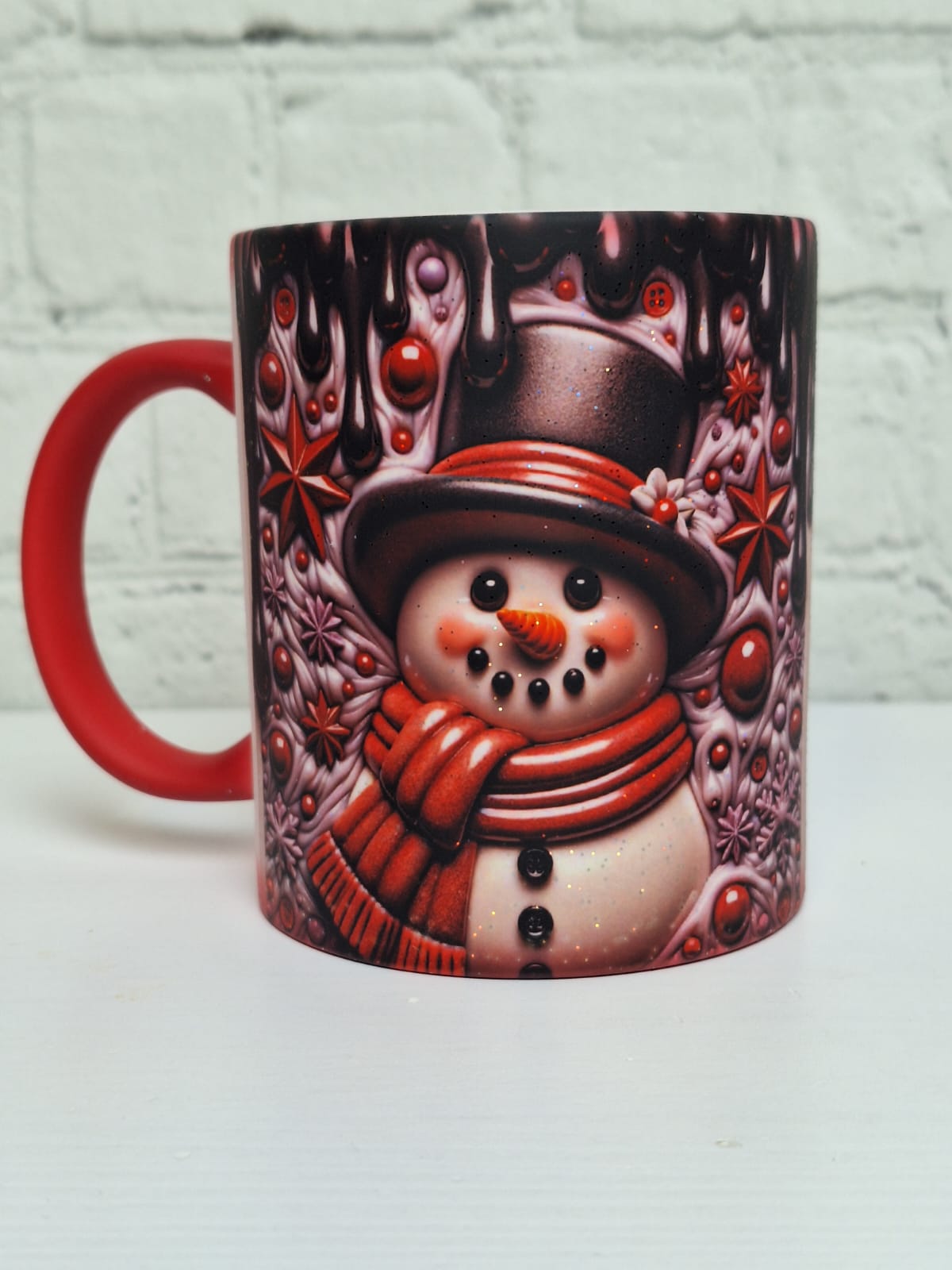 Glitzer-Zaubertasse „Schneemann Schwarz/Rot“
