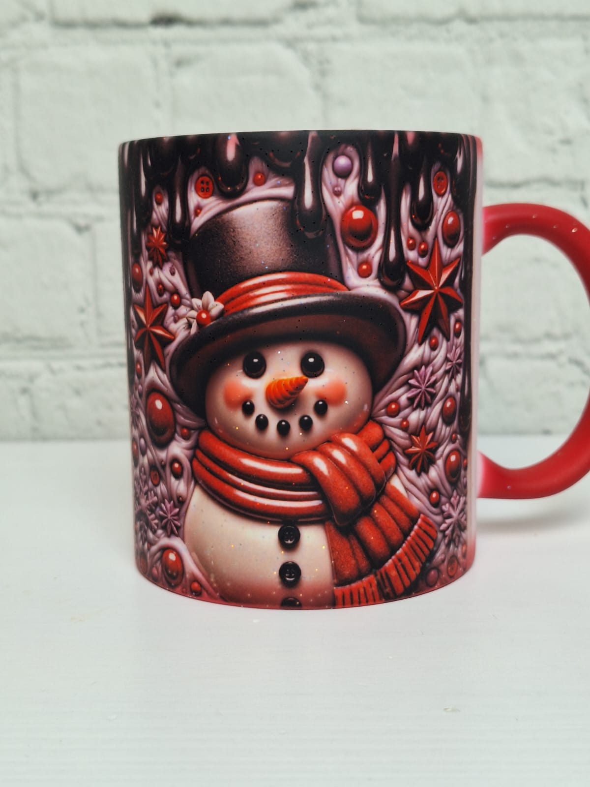 Glitzer-Zaubertasse „Schneemann Schwarz/Rot“