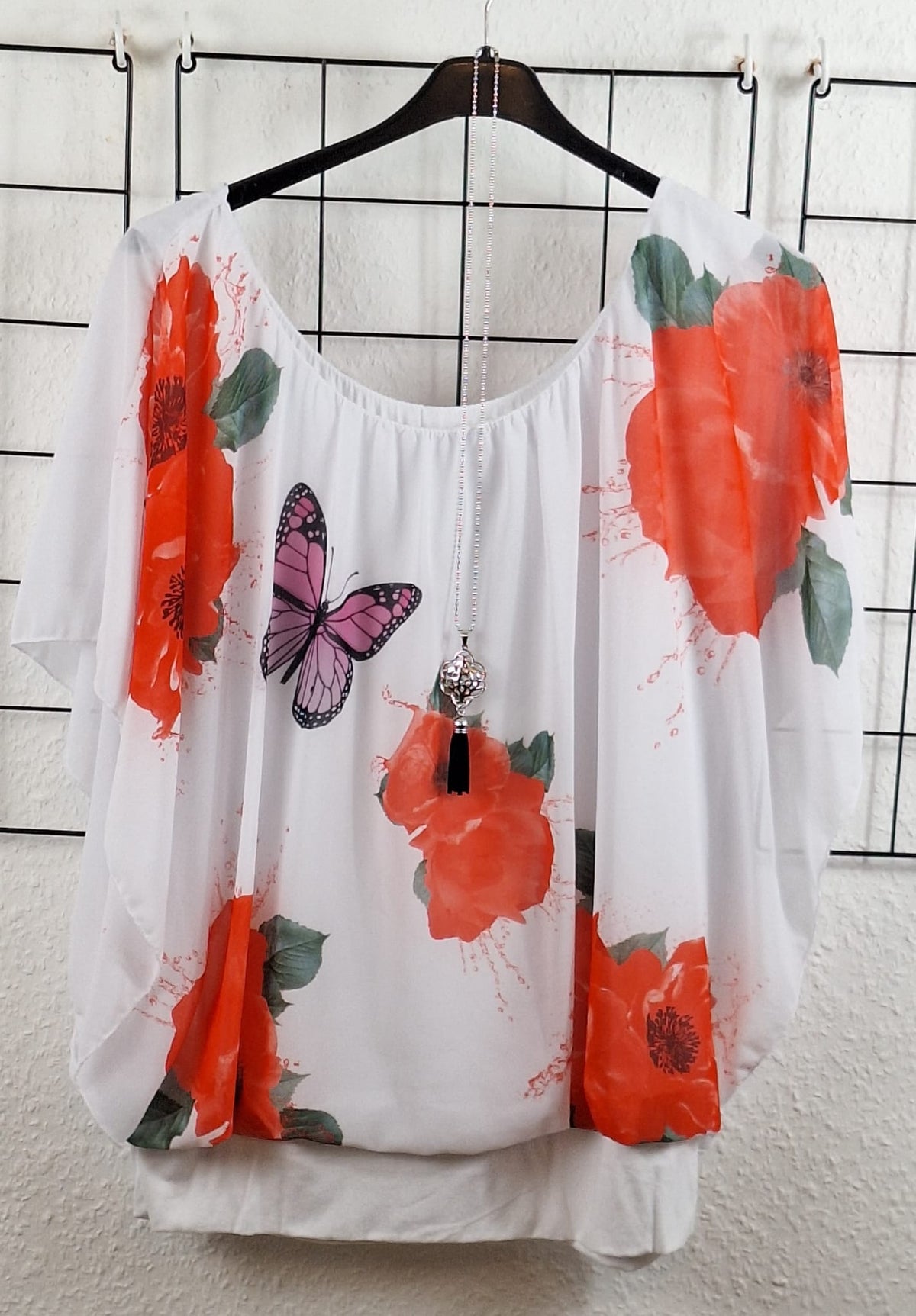 Damen Bluse mit Schmetterling Motiv locker geschnitten für den Sommer
